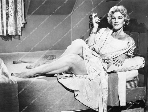 Veda Ann Borg in bed smoking a cigarette - 1958 The Fearmakers - 0432-036