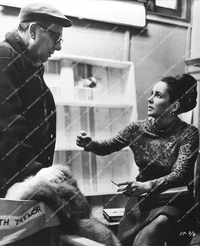 director Martin Ritt gets visit from Elizabeth Taylor on set - 1965 film The Spy Who Came in from the Cold - 0445-014