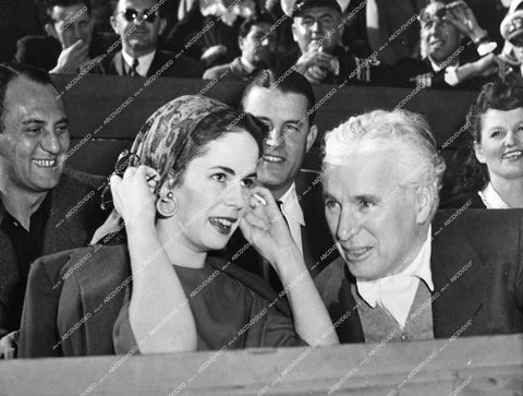 Charles Chaplin and wife Oona Chaplin at some sporting event 1945 - 0451-021