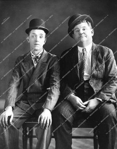 Stan Laurel, Oliver Hardy - 1927 silent short subject film Hats Off - 0461-010