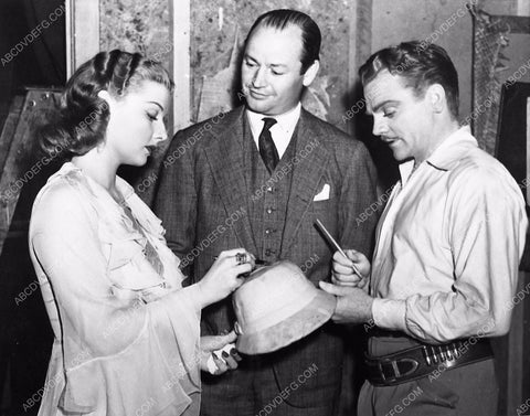 candid Ann Sheridan James Cagney signing a hat on set Torid Zone 337-29