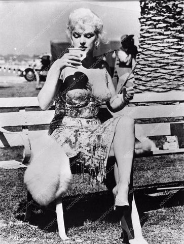 candid Marilyn Monroe behind the scenes enjoying a cup of coffee 695-03