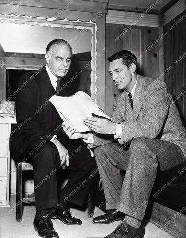 Cary Grant candid with Tony Moreno going over script behind the scenes 711-06