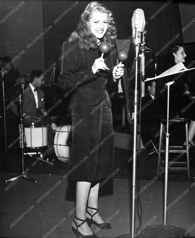 beautiful Rita Hayworth shaking the maracas for radio broadcast 735-13