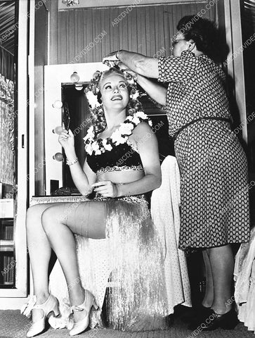 beautiful Betty Grable and her legs get last minute makeup in her dressing room 745-01