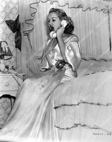 Betty Grable yawning over a telephone conversation 745-07