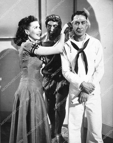 Ann Miller measuring someones head 798-21