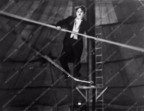 Charlie Chaplin doing a high wire act 836-13