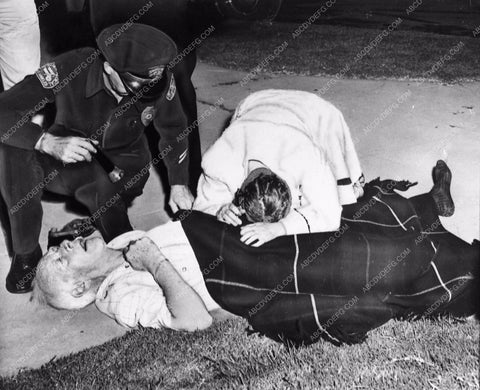 news photo police and others try to revive Lewis Stone in front of home 1104-25