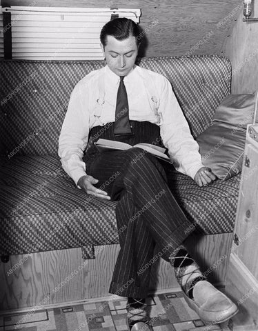 candid Robert Young reading in his dressing room between takes 1197-36