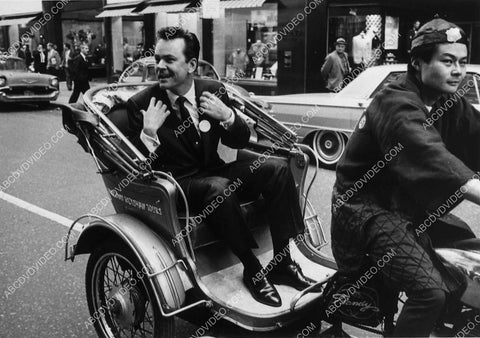 Bob Crane goes for a ride in a rickshaw 12592-18