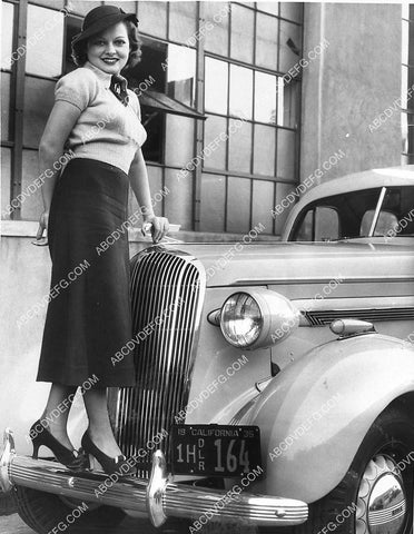 some cute girl on a new 1935 Buick automobile 1319-08