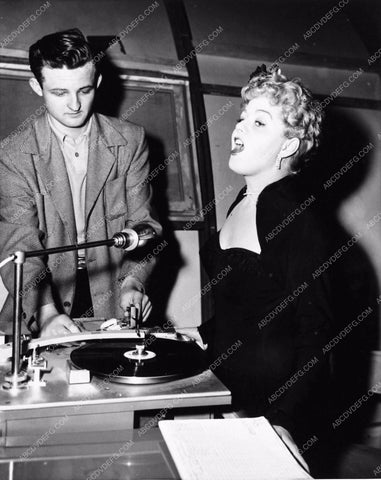 candid Shelley Winters singing away to the record player My Man and I 1425-09