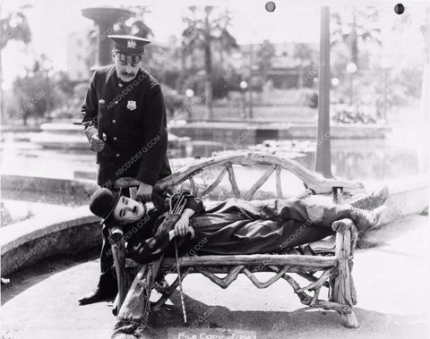 Charlie Chaplin getting rousted by the cops silent film 1598-07