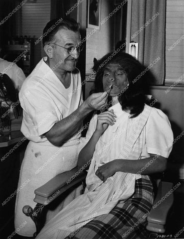 Vicky Lane sits in Jack Pierce's makeup chair for horror film The Jungle Captive 1629-24