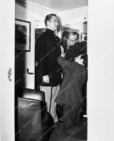 candid Nelson Eddy wardrobe fitting in his dressing room MGM 1674-34