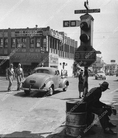 historic Los Angeles Hollywood Blvd w a 1936 Dodge automobile stopped at intersection 1721-22