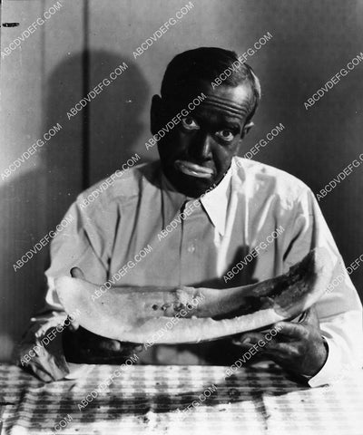 Al Jolson in blackface w a slice of watermelon film Go Into Your Dance 1915-17