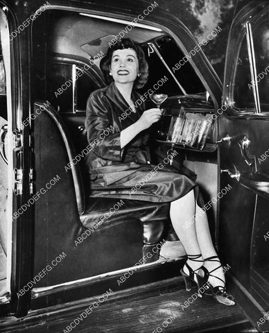 lady has cool cocktail bar in her 1938 Cadillac automobile (probably illegal today) 1940-19