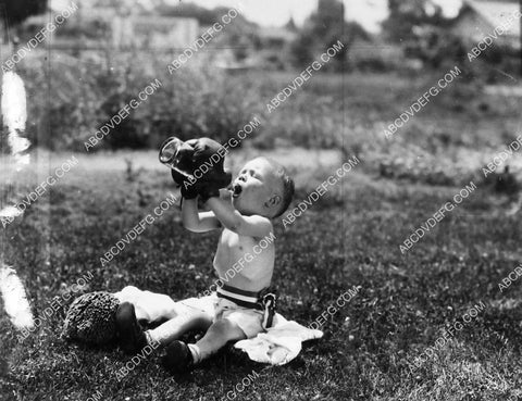 Our Gang Wheezer drinking out of a bottle w boxing gloves on 1969-19