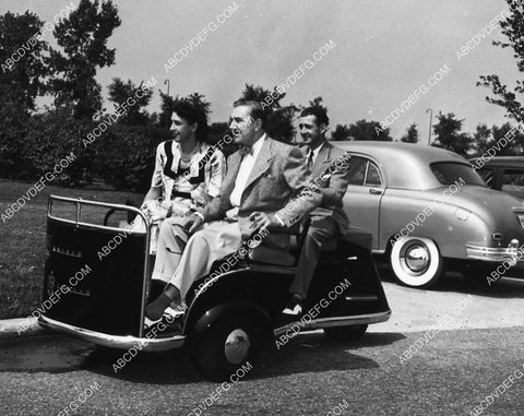 Bela Lugosi and wife on cool golf type cart 2112-23