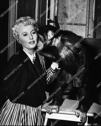 Barbara Stanwyck hugging the monkey behind the scenes 2237-06