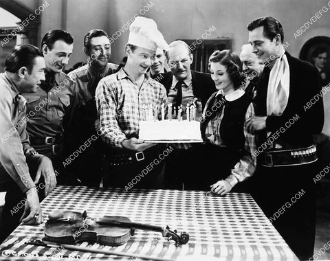 Charles Starrett & The Sons of the Pioneers give Iris Meredith birthday cake West of Cheyenne 2253-08