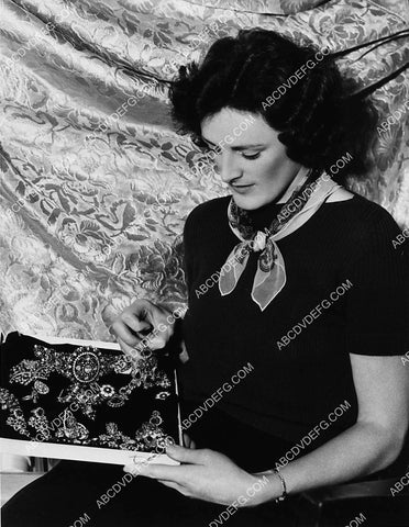 MGM Studios girl working in wardrobe dept selects material and jewels 2308-27