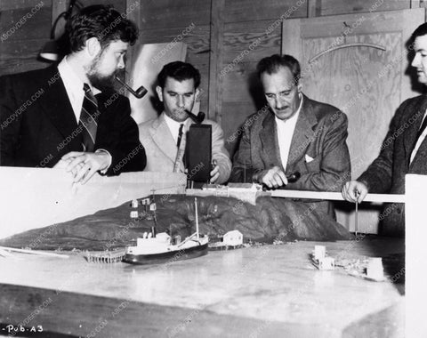 candid Orson Welles working on script film details with model sets 2418-22