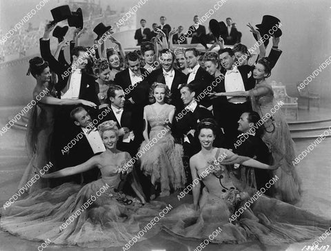 Judy Garland surrounded by all the dancers for musical number 2666-1