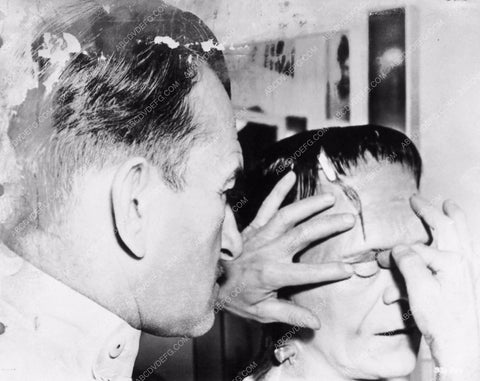 Jack Pierce applying Boris Karloff's Frankenstein makeup behind the sc 2706-24