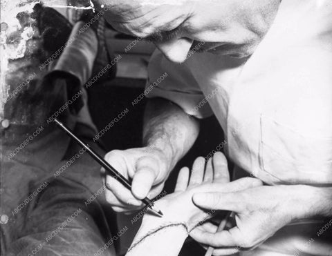 Jack Pierce applying Boris Karloff's Frankenstein makeup behind the sc 2706-32