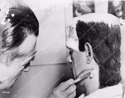 Jack Pierce and his hairdryer get Boris Karloff ready as Frankenstein 2707-18