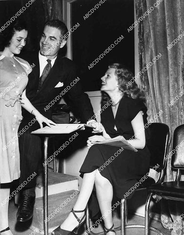 Charles Korvin Rita Hayworth and girl go over the script 2714-28