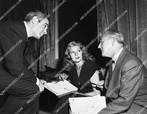 Charles Korvin Rita Hayworth and someone go over the script 2714-30