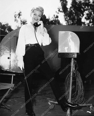 Lana Turner gets remote phone call on MGM Studios backlot 2864-23