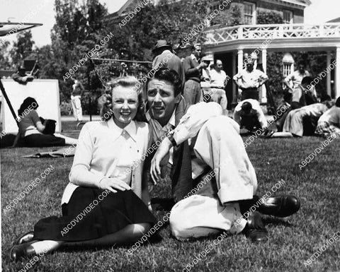 2883-021 candid June Allyson, Peter Lawford sitting on grass between takes film Good News 2883-021
