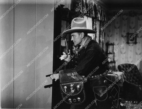 Buck Jones in a shootout film The Forbidden Trail 2996-21