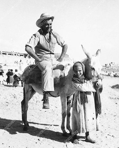 Robert Taylor rides a donkey on location in Egypt film Valley of the Kings 3259-07