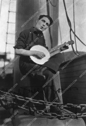 Leatrice Joy strumming on the banjo 3443-28