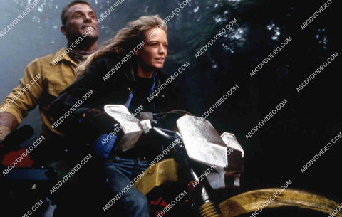 Howie Long Suzy Amis zipping along on a motorcycle film Firestorm 35m-15521