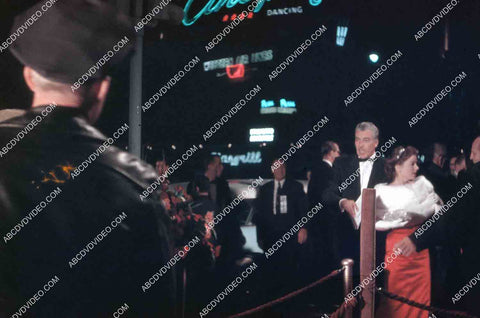 Cesar Romero and date attend film premiere James Dean Giant 35m-16538