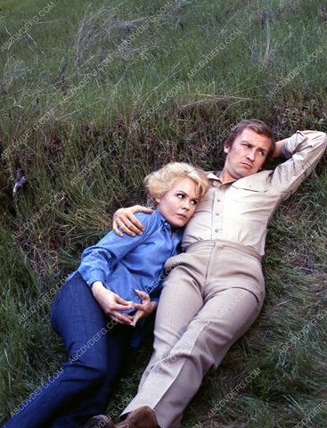 Sandra Dee lying in the grass with some guy 35m-2519