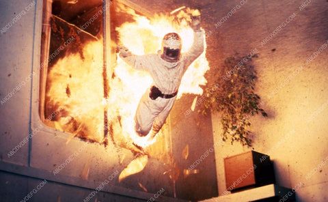 man in bee keeper suit jumps from burning building film The Swarm 35m-4696