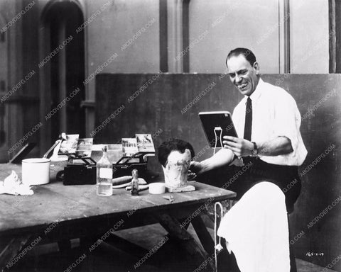 Lon Chaney Sr. testing his makeup skills with his box of tools 3949-32