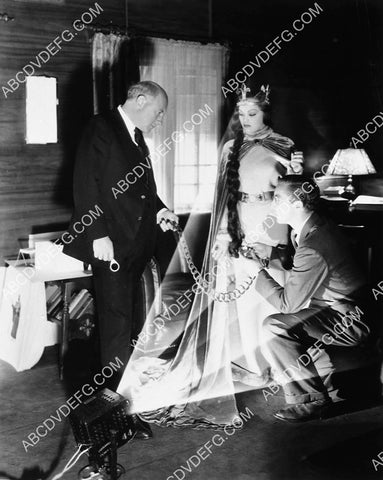 Cecil B DeMille and wardrobe guy check (Loretta Young?) costume on set 4588-05