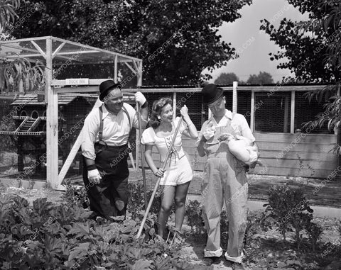 candid Stan Laurel Oliver Hardy tend garden at home in backyard 45bx08-288