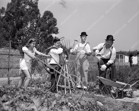 candid Stan Laurel Oliver Hardy tend garden at home in backyard 45bx08-290