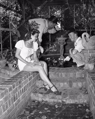 candid Stan Laurel Oliver Hardy tend garden at home in backyard 45bx08-297