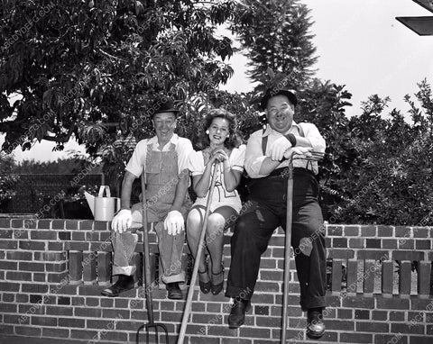 candid Stan Laurel Oliver Hardy tend garden at home in backyard 45bx08-305